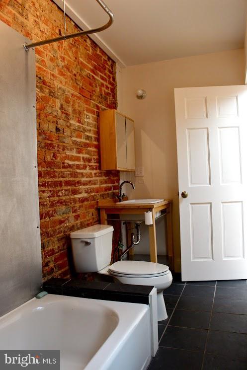 523 Budd Street Philadelphia, PA 19104 - Photo 30 of 48 a bathroom with a toilet and a sink