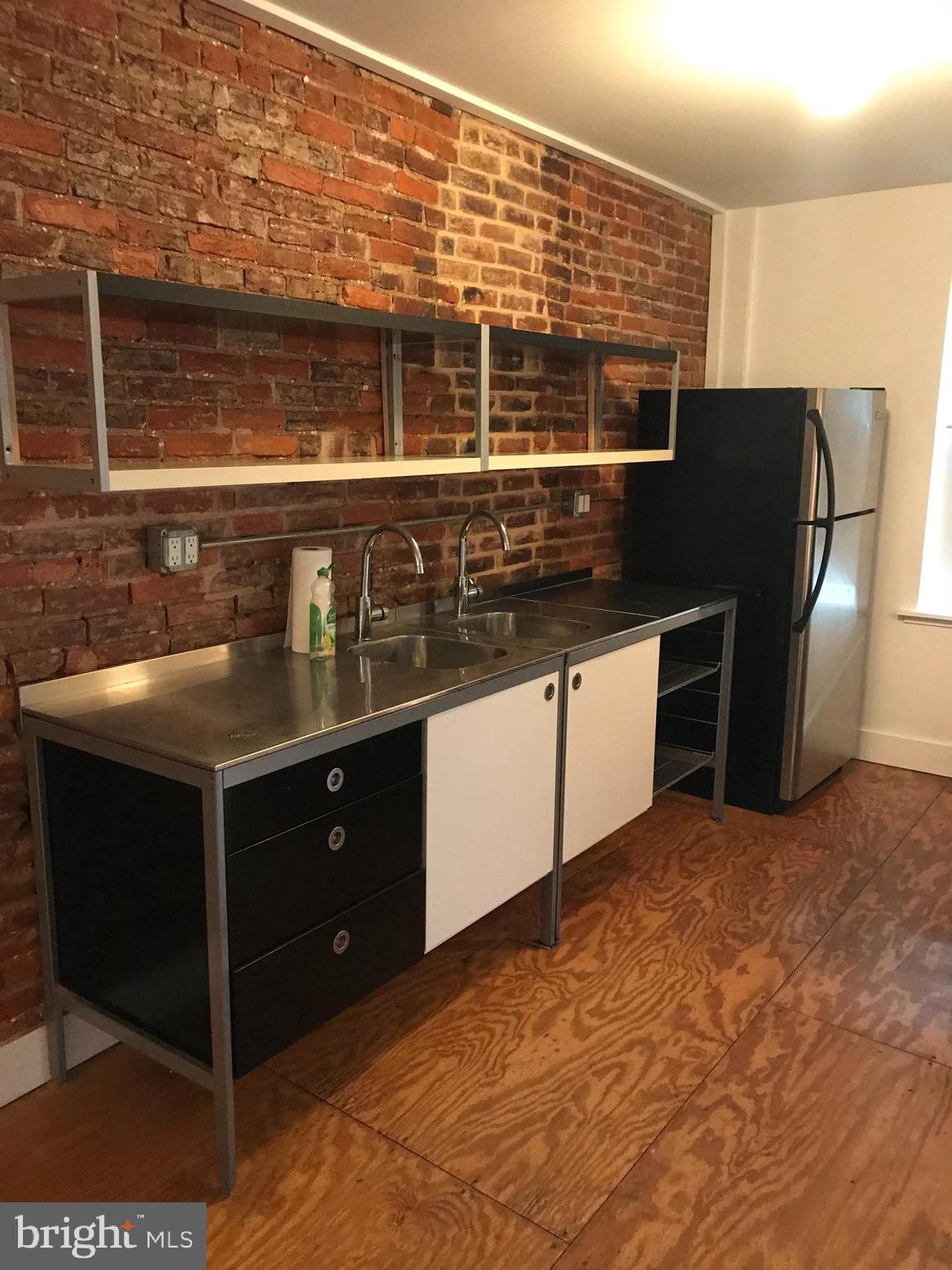523 Budd Street Philadelphia, PA 19104 - Photo 5 of 48 a kitchen with stainless steel appliances granite countertop a stove and a refrigerator