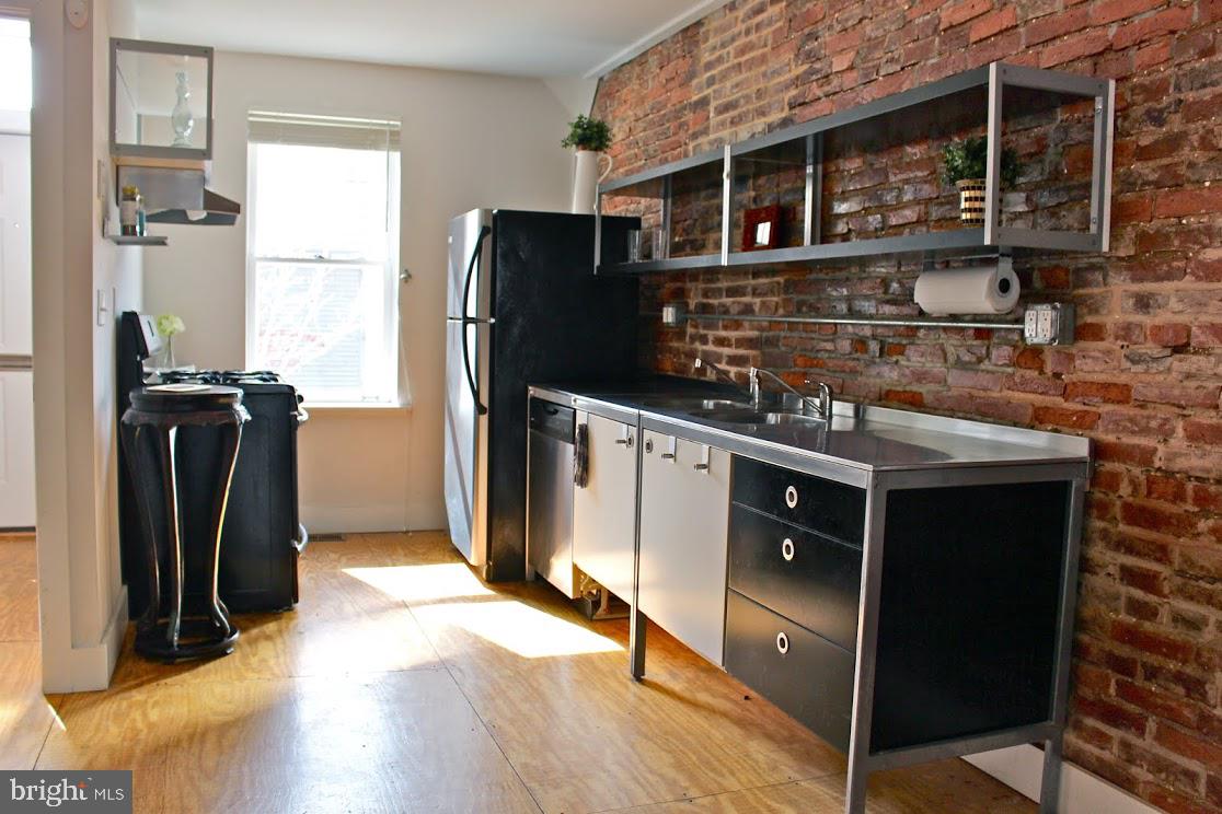 523 Budd Street Philadelphia, PA 19104 - Photo 6 of 48 a kitchen with stainless steel appliances granite countertop a refrigerator and a sink