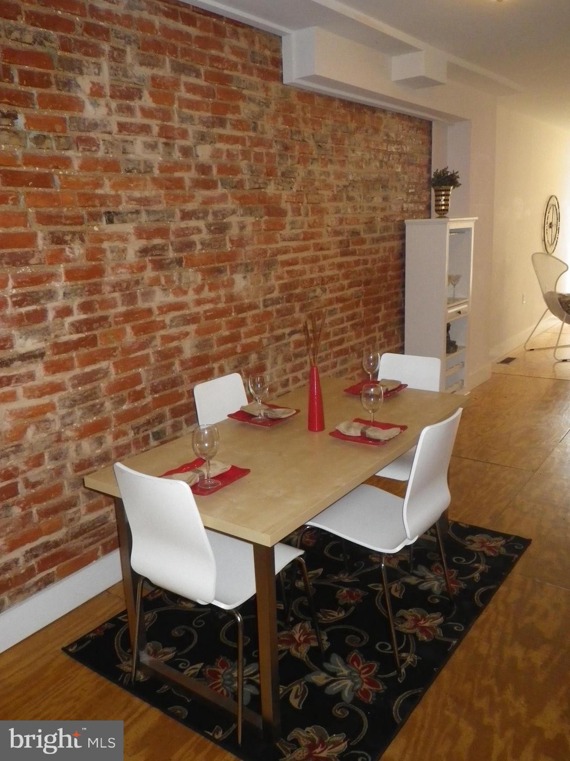 523 Budd Street Philadelphia, PA 19104 - Photo 8 of 48 a view of a dining room with furniture and wooden floor