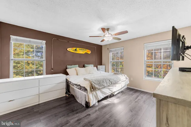 a bedroom with a large bed and a window