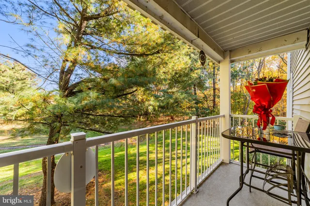 a view of balcony with furniture