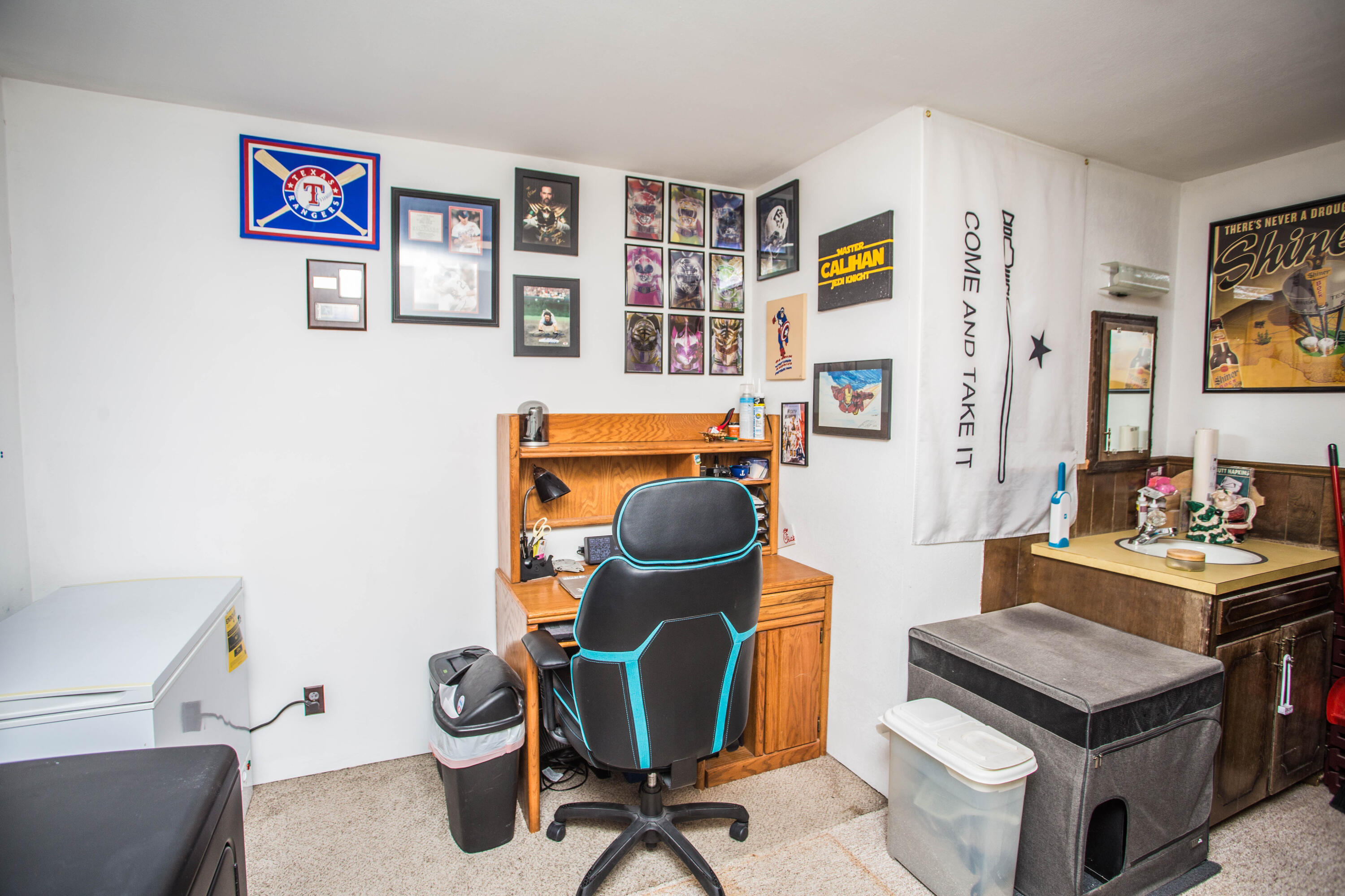 705 South 22nd Street Slaton, TX 79364 - Photo 11 of 30 a view of a workspace with furniture and toys