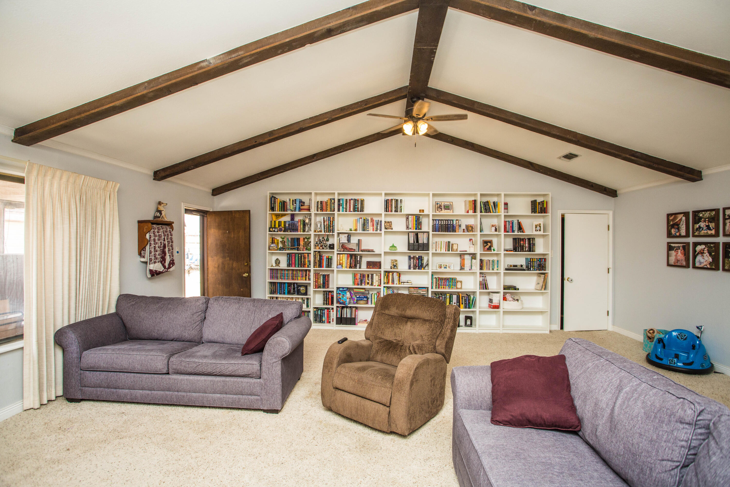 705 South 22nd Street Slaton, TX 79364 - Photo 13 of 30 a living room with furniture and a window