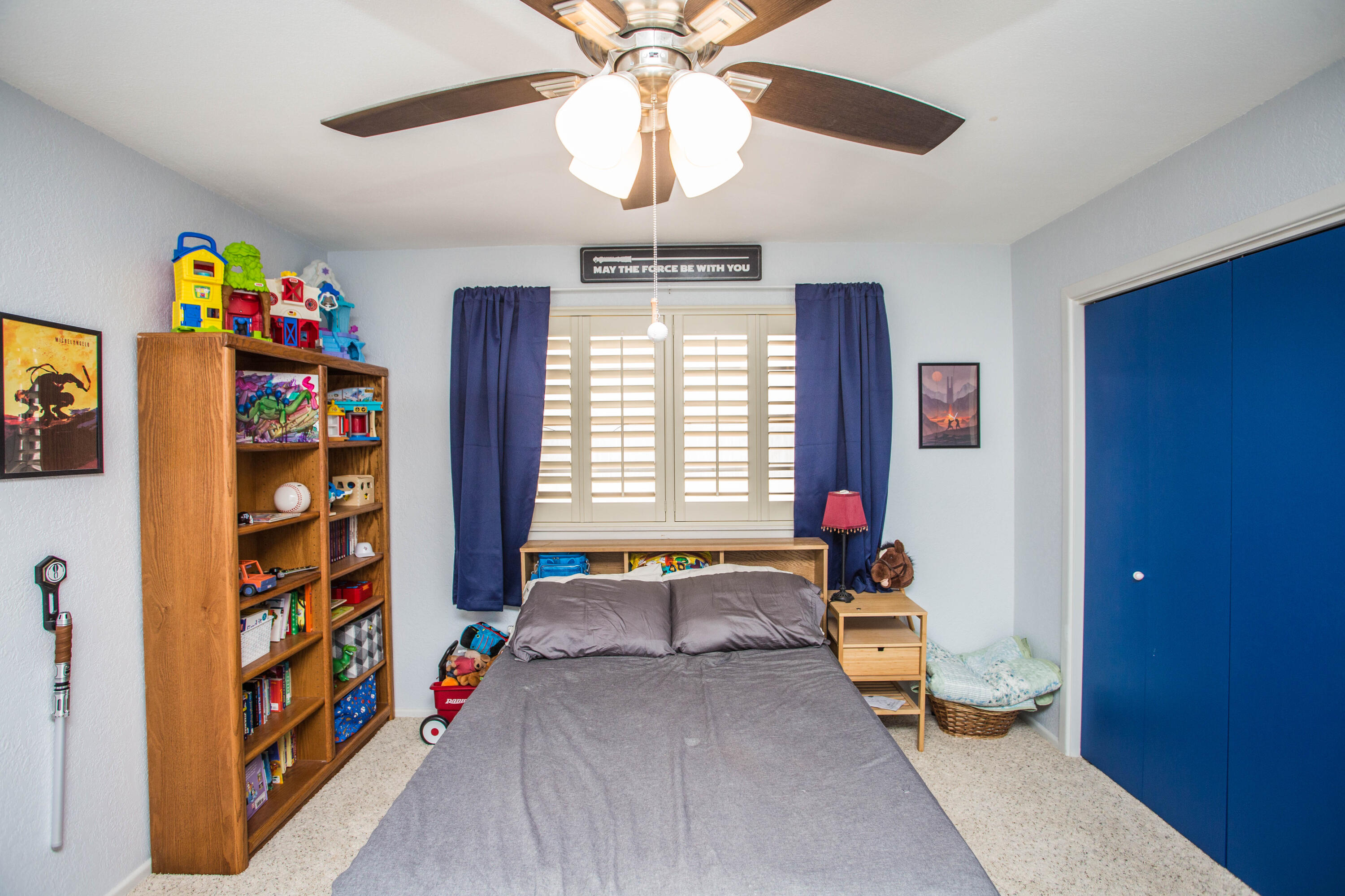 705 South 22nd Street Slaton, TX 79364 - Photo 19 of 30 a living room with lots of furniture and a chandelier