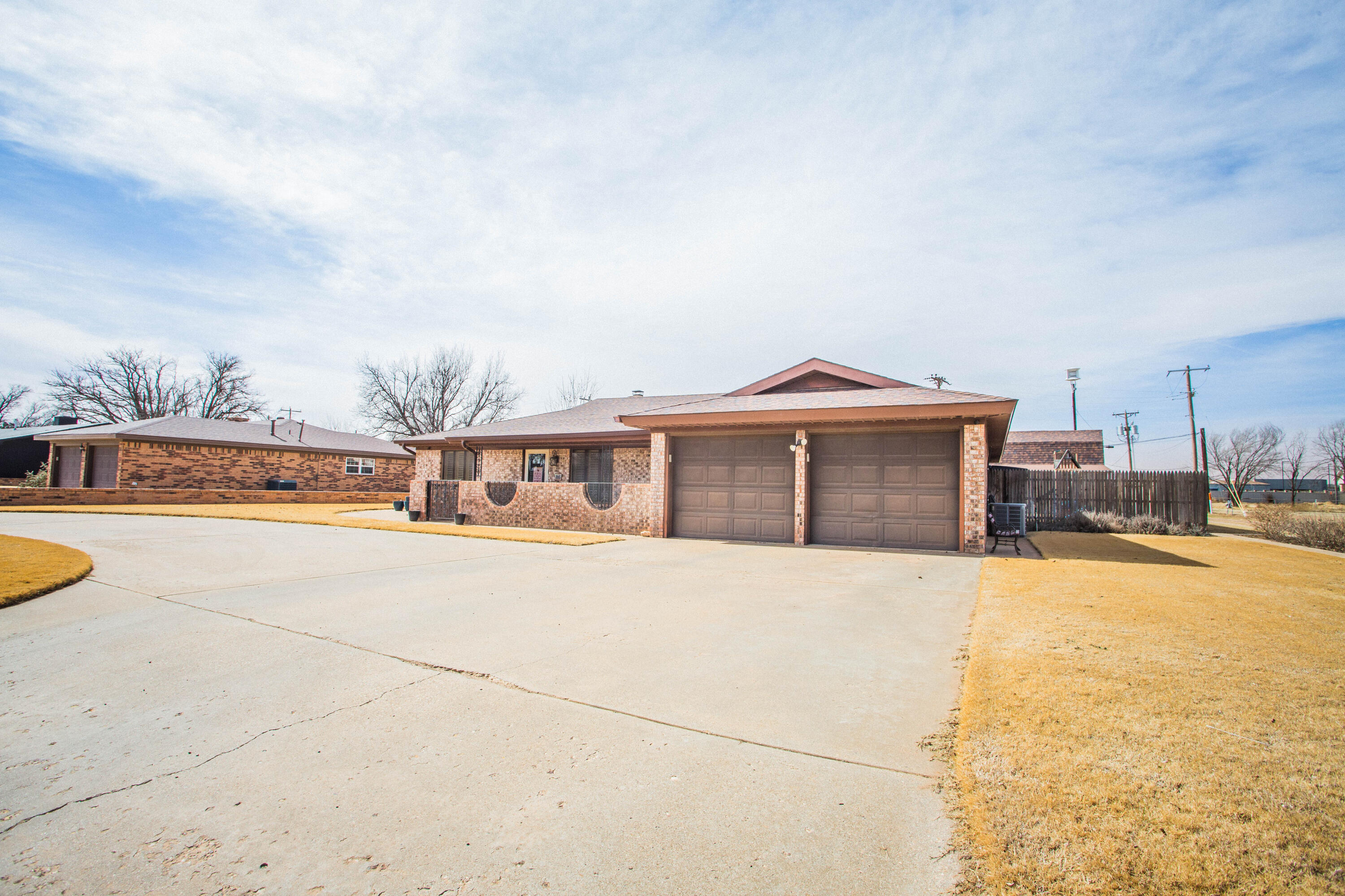 705 South 22nd Street Slaton, TX 79364 - Photo 2 of 30 a view of house with swimming pool and sitting area