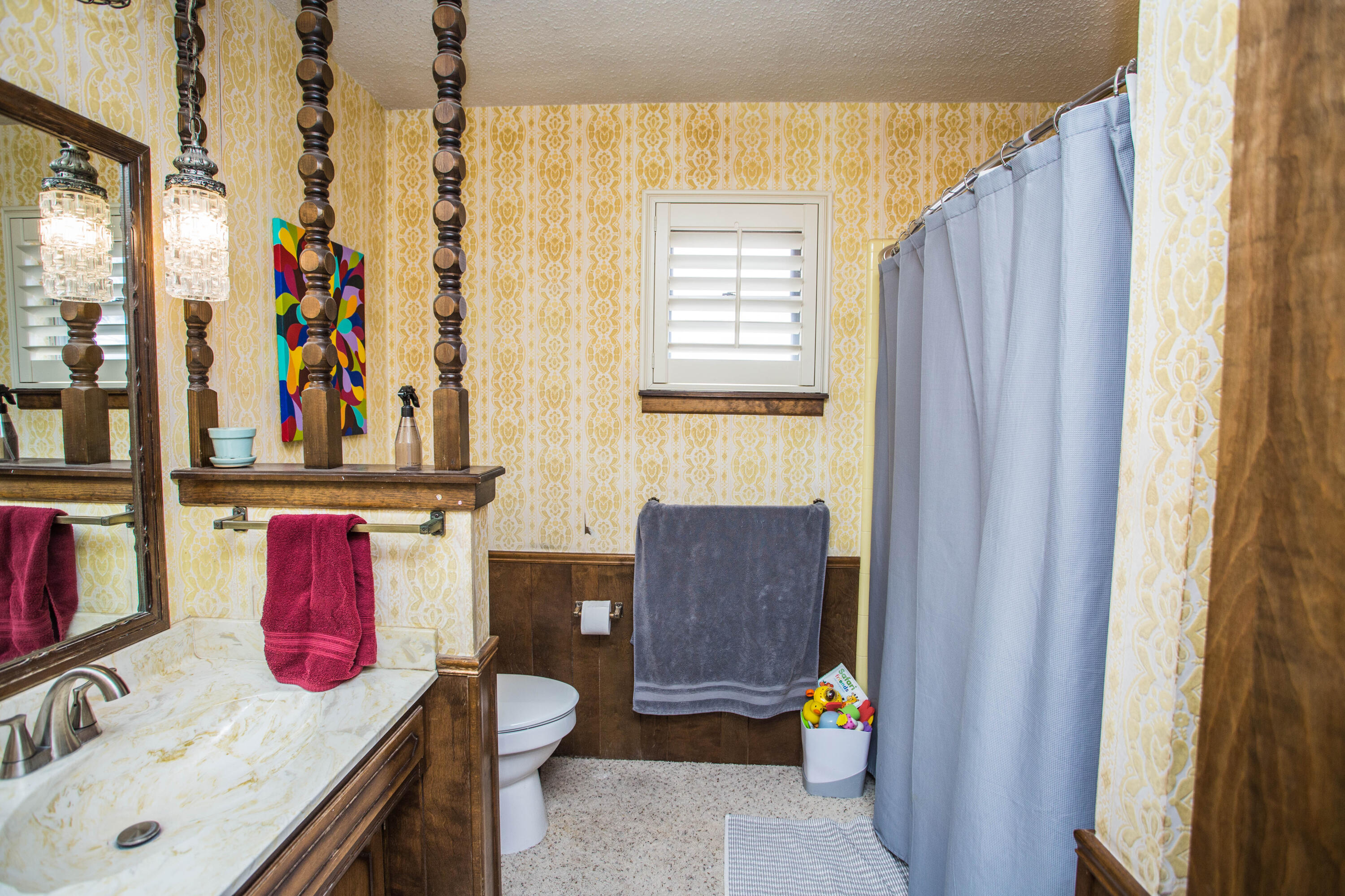 705 South 22nd Street Slaton, TX 79364 - Photo 22 of 30 a bathroom with a sink and a mirror