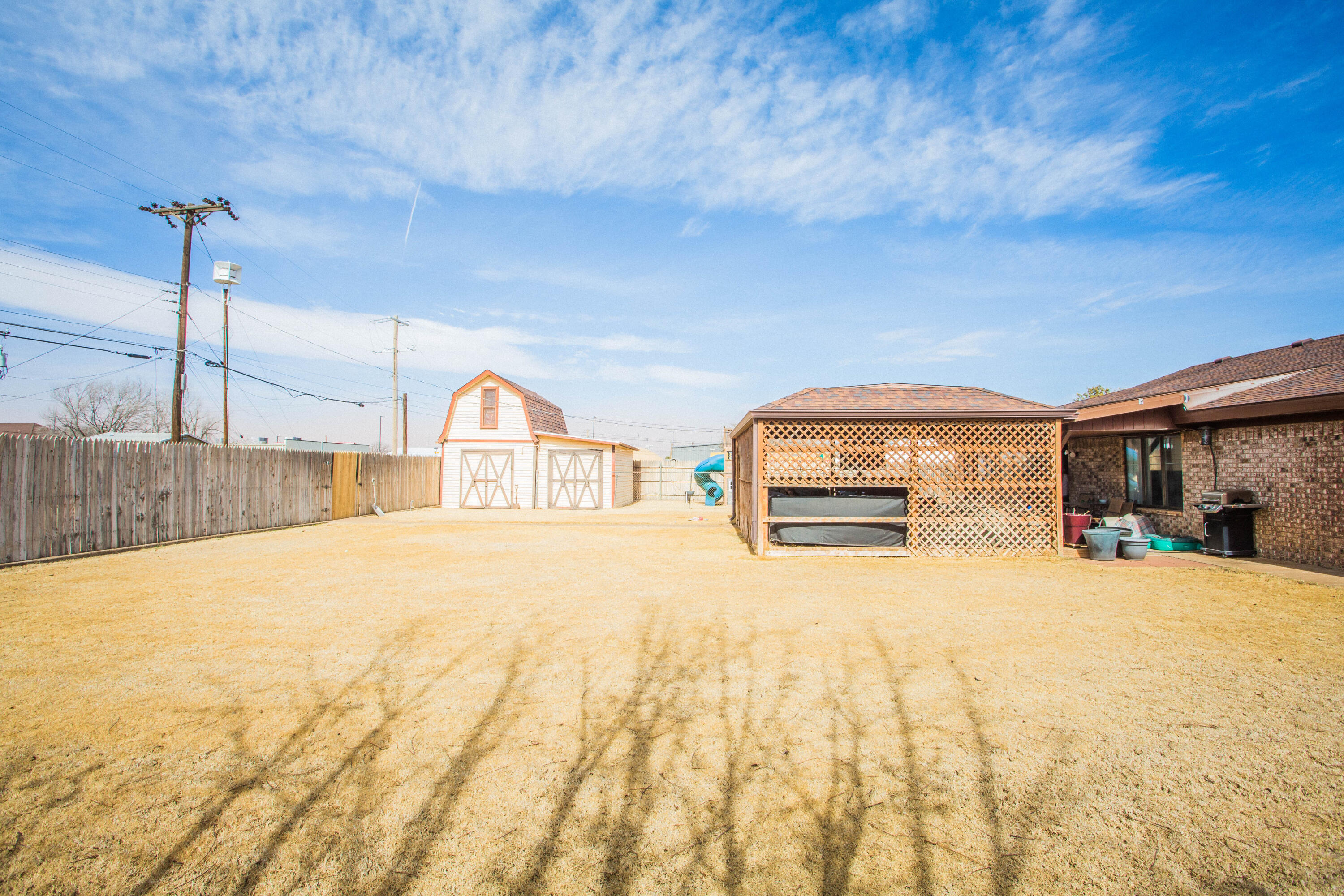 705 South 22nd Street Slaton, TX 79364 - Photo 29 of 30 a swimming pool with a yard