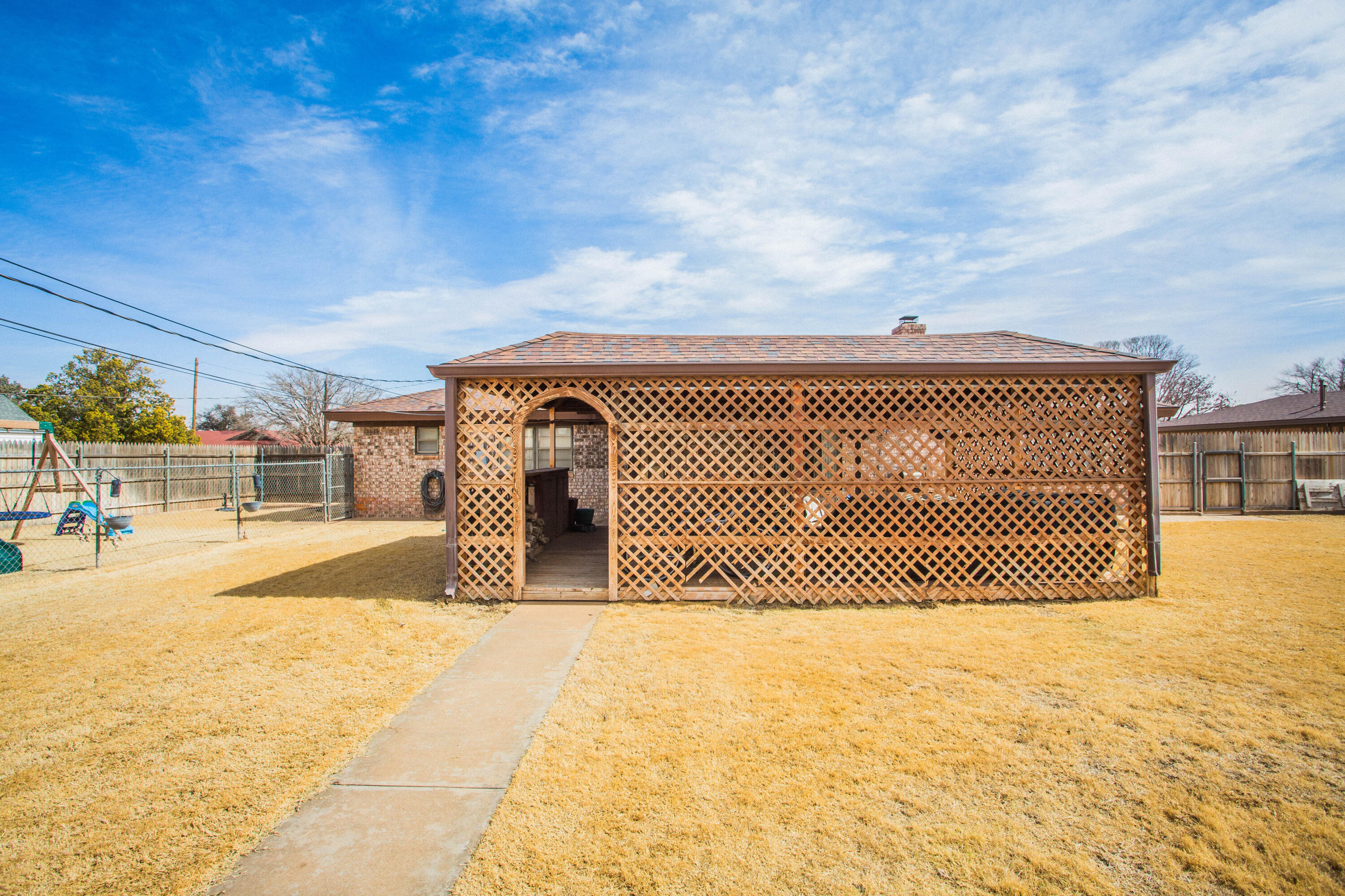 705 South 22nd Street Slaton, TX 79364 - Photo 30 of 30 a front view of a house with a yard