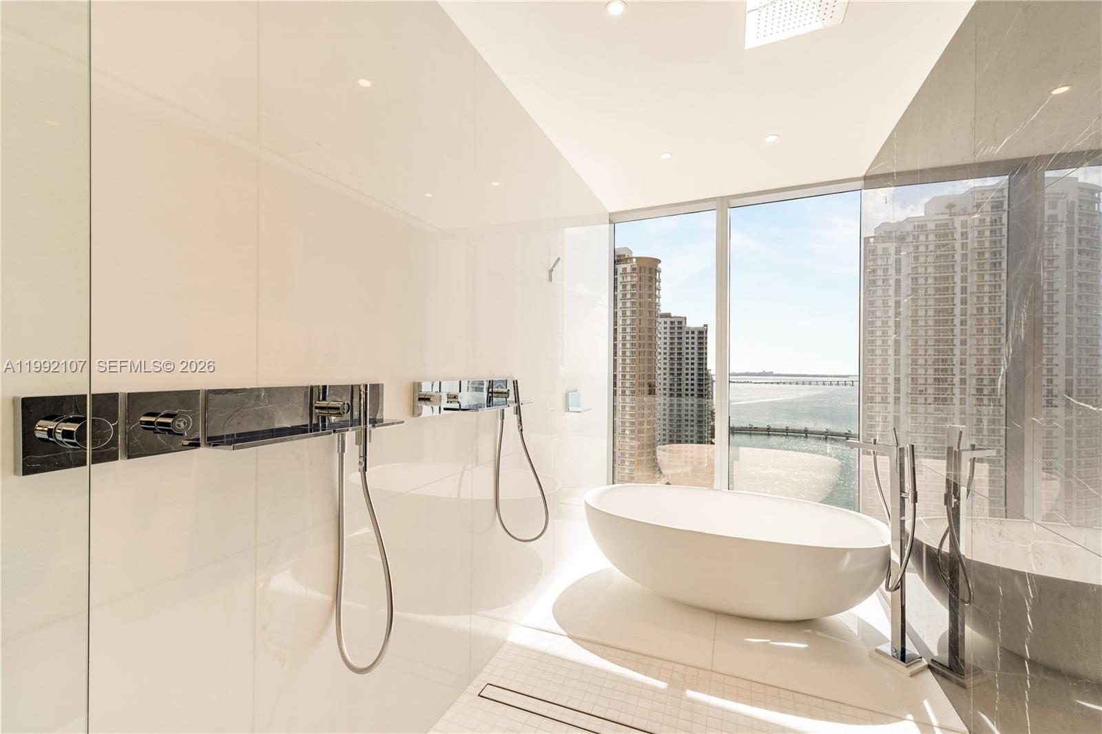 300 Biscayne Blvd Way, Unit 2103C Miami, FL 33131 - Photo 23 of 41 a view of a living room and a glass door
