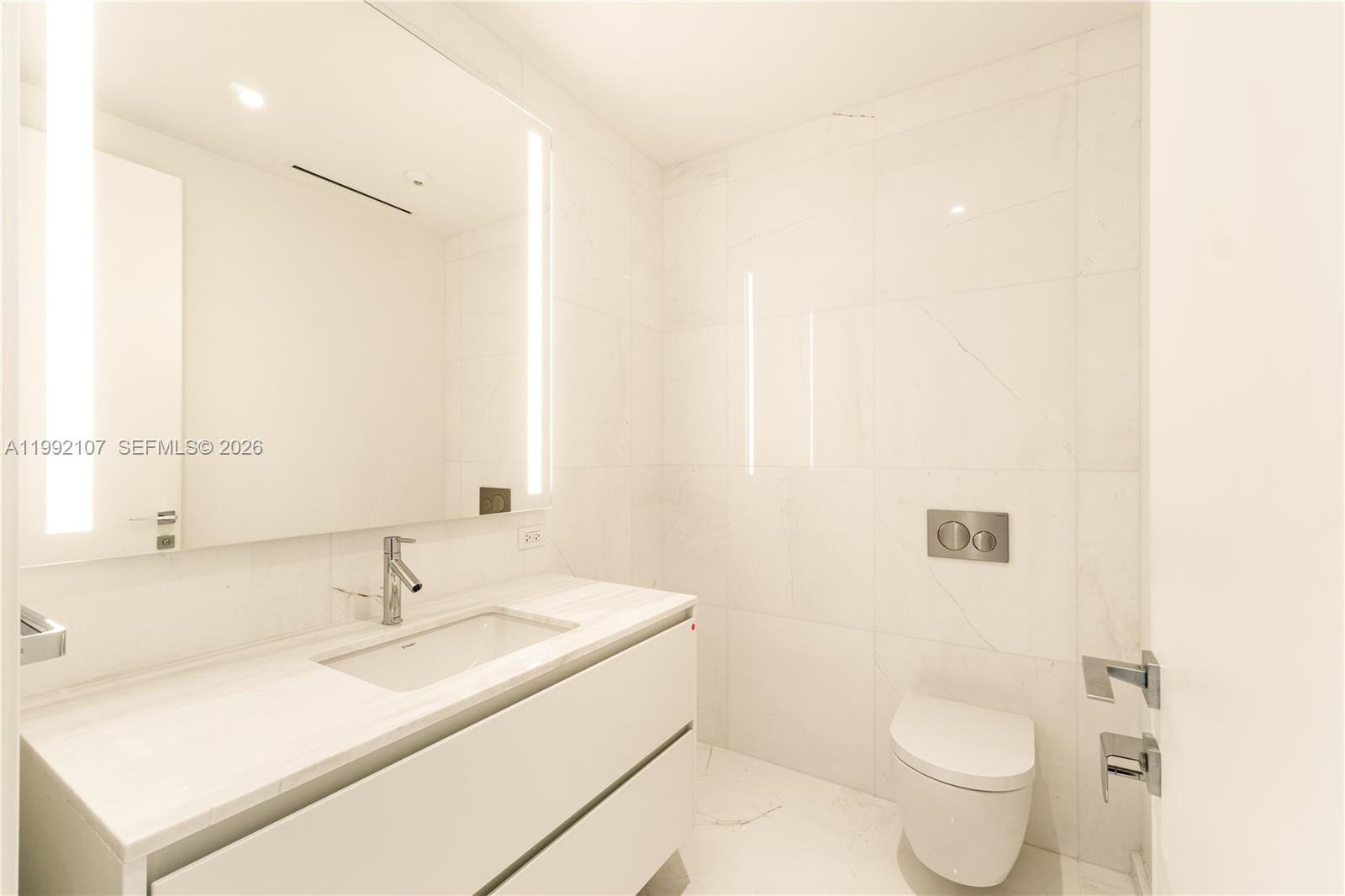 300 Biscayne Blvd Way, Unit 2103C Miami, FL 33131 - Photo 29 of 41 a bathroom with a sink and a toilet