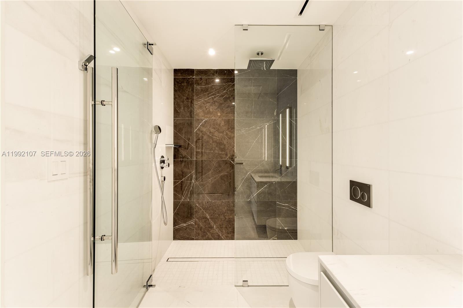 300 Biscayne Blvd Way, Unit 2103C Miami, FL 33131 - Photo 31 of 41 a bathroom with a shower and a sink