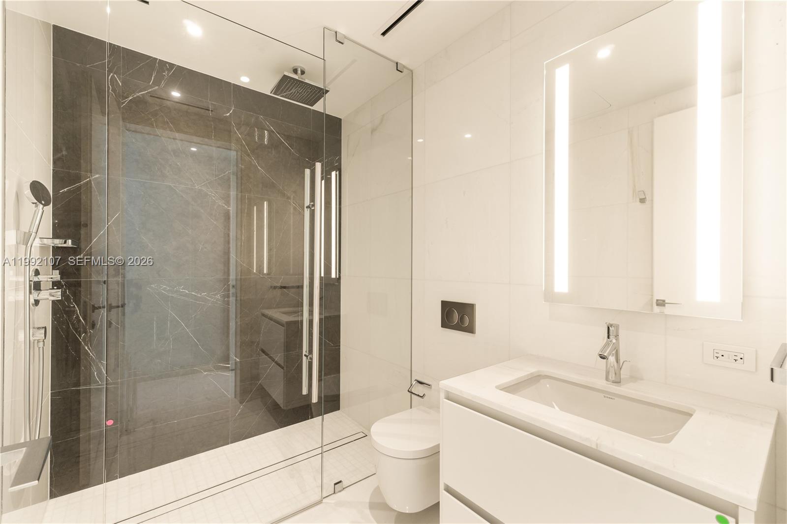 300 Biscayne Blvd Way, Unit 2103C Miami, FL 33131 - Photo 32 of 41 a bathroom with a sink toilet and shower