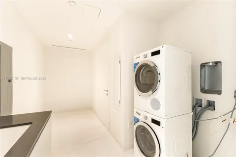 a view of storage and utility room with washer and dryer