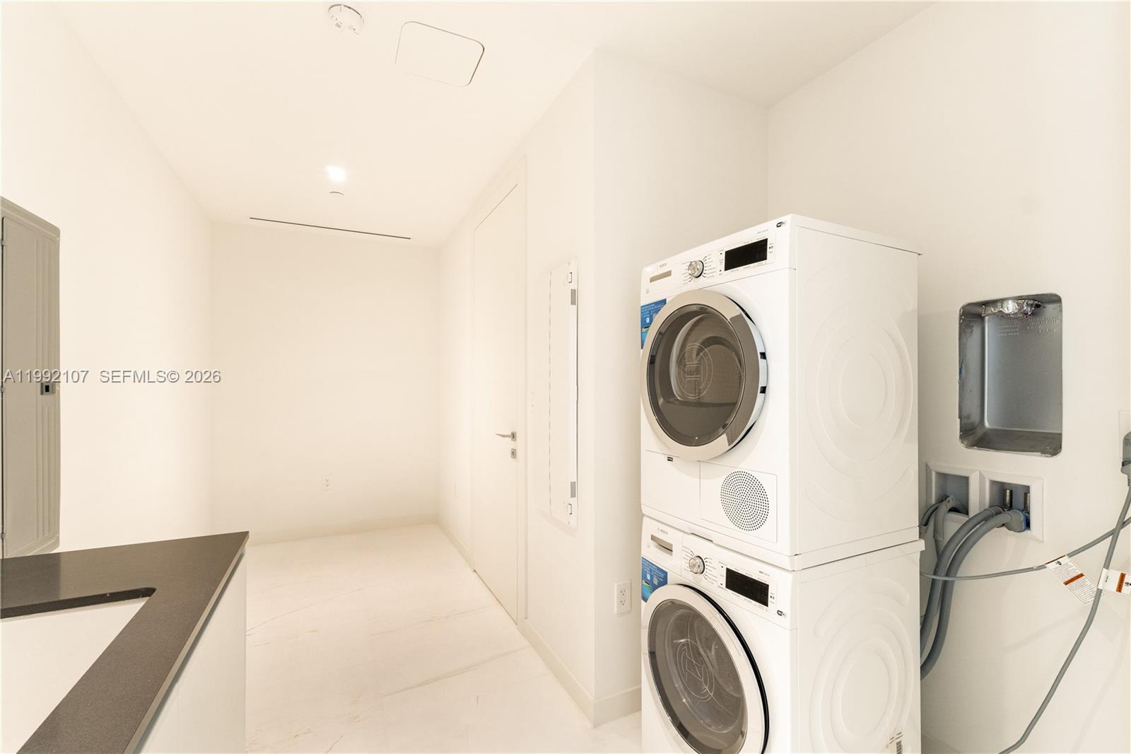 300 Biscayne Blvd Way, Unit 2103C Miami, FL 33131 - Photo 34 of 41 a view of storage and utility room with washer and dryer