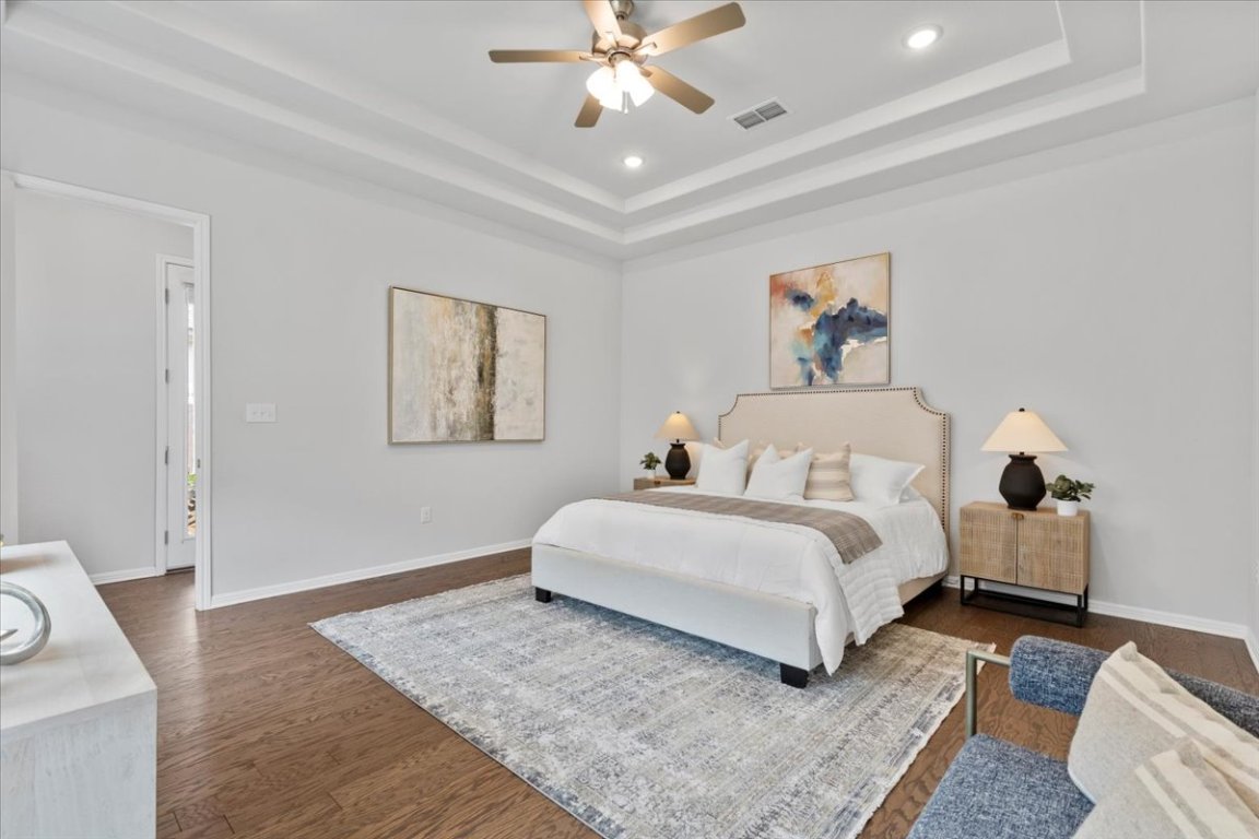 271 Eclipse Drive Austin, TX 78737 - Photo 13 of 39 a spacious bedroom with a bed and a couch