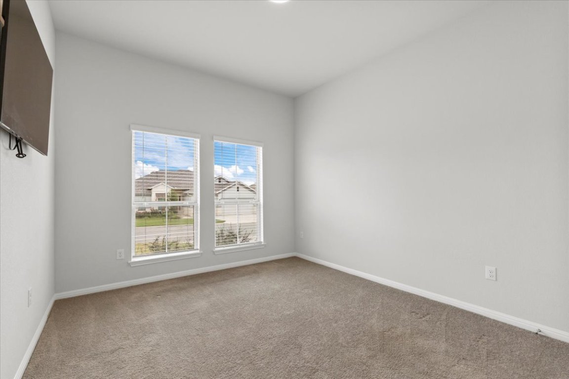 271 Eclipse Drive Austin, TX 78737 - Photo 23 of 39 an empty room with windows