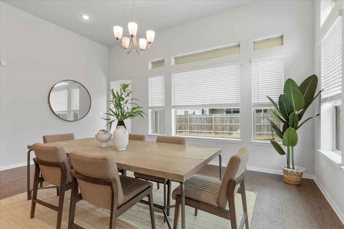 271 Eclipse Drive Austin, TX 78737 - Photo 8 of 39 a view of a dining room with furniture window and wooden floor