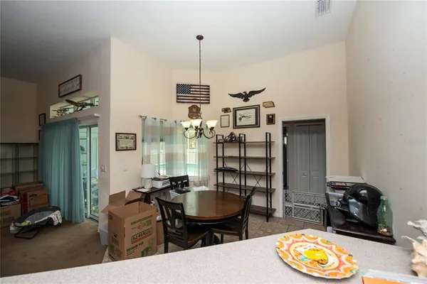a view of a livingroom with furniture and a window