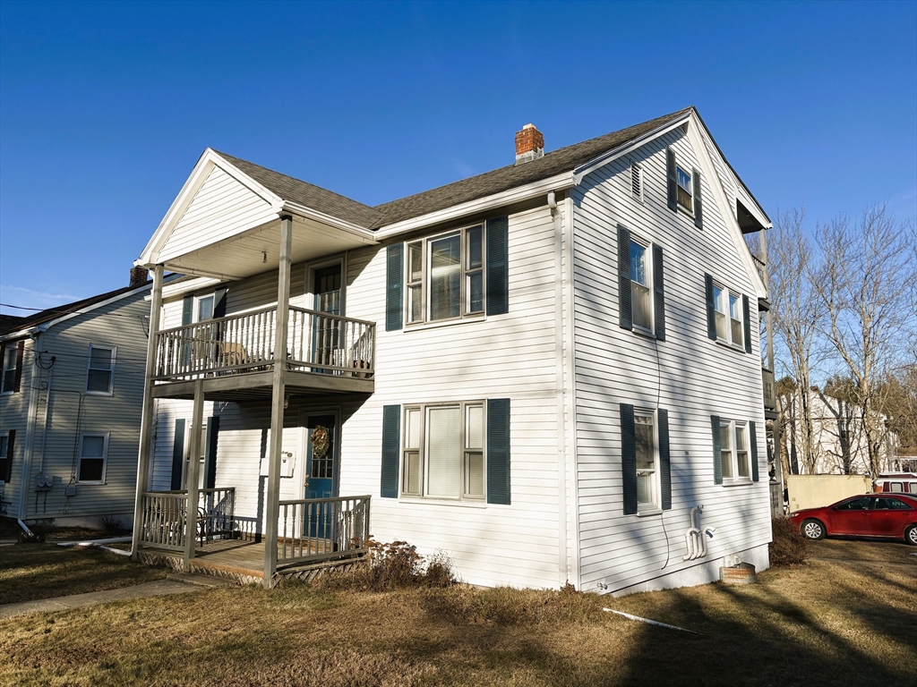 14 Racicot Avenue Webster, MA 01570 - Photo 1 of 12 a front view of a house with a yard