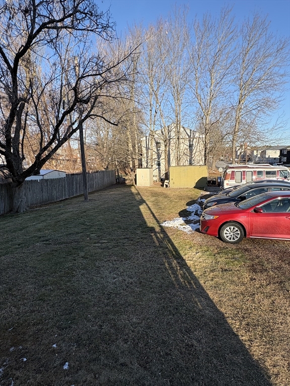 14 Racicot Avenue Webster, MA 01570 - Photo 12 of 12 a view of a backyard with trees