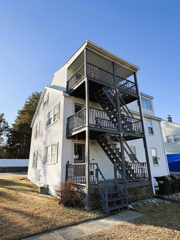 14 Racicot Avenue Webster, MA 01570 - Photo 3 of 12 a front view of a house with a balcony