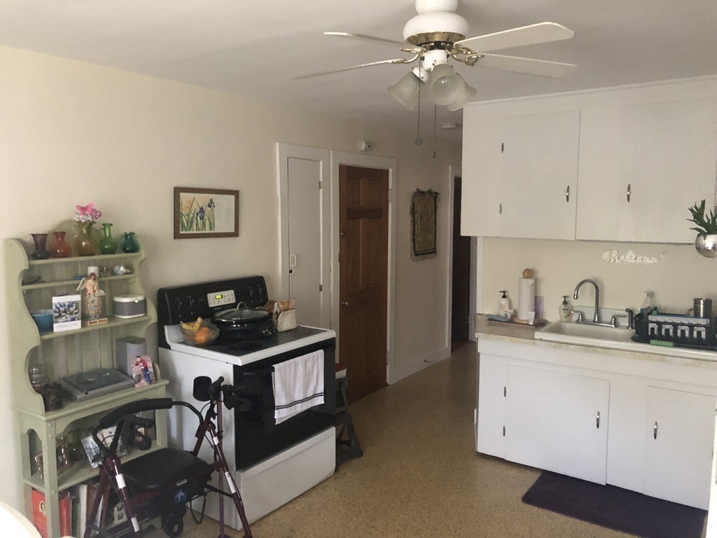 14 Racicot Avenue Webster, MA 01570 - Photo 4 of 12 a view of a workspace with furniture and cabinets