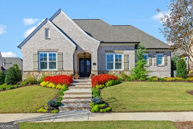 a front view of a house with a yard