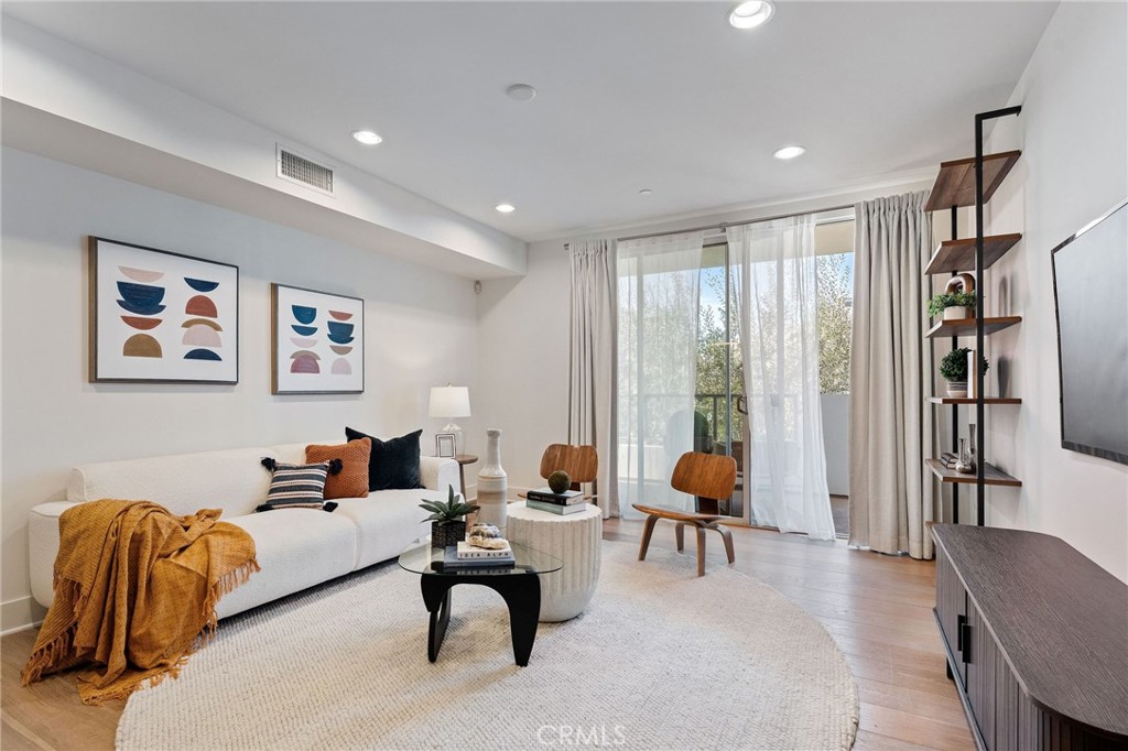 a living room with furniture or couch and a flat screen tv