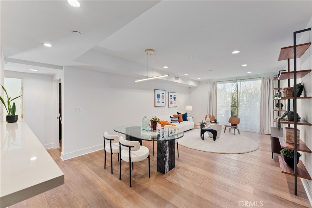 118 North Kings Road, Unit 201 Los Angeles, CA 90048 - Photo 11 of 38 a living room with dining room and wooden floor