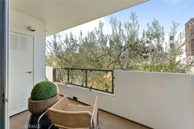 a balcony with table and chairs