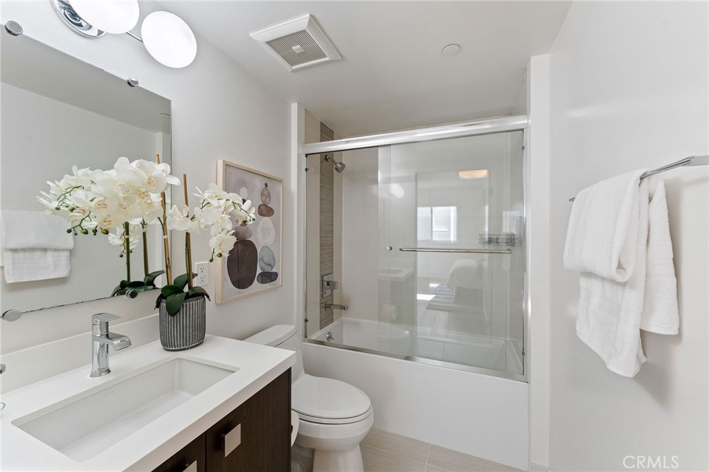 118 North Kings Road, Unit 201 Los Angeles, CA 90048 - Photo 26 of 38 a bathroom with a sink a toilet and shower
