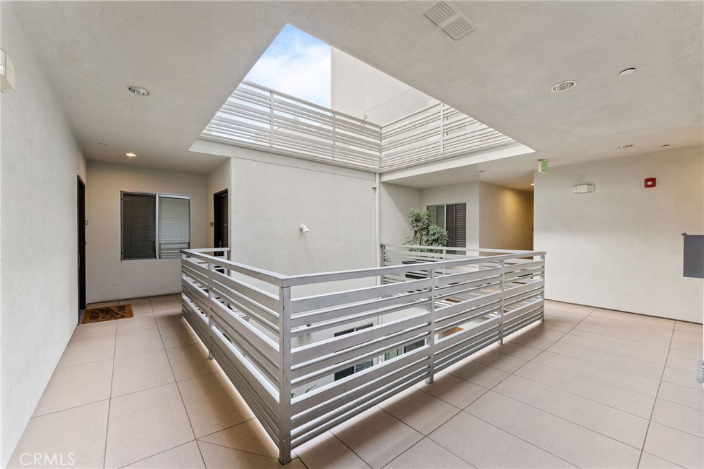 118 North Kings Road, Unit 201 Los Angeles, CA 90048 - Photo 37 of 38 a view of kitchen with granite countertop furniture and a ceiling fan
