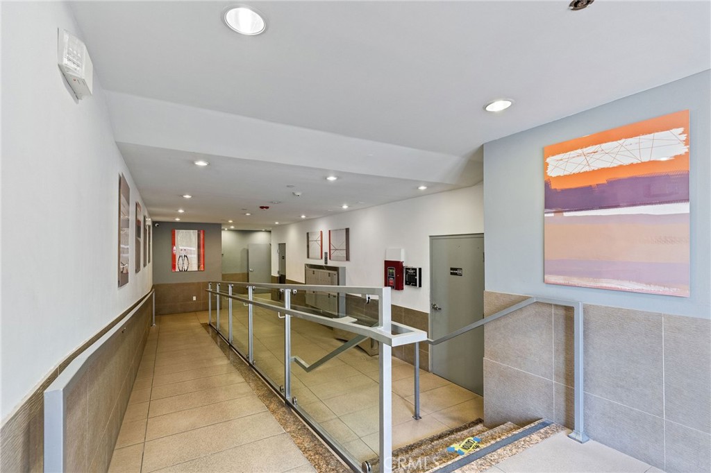 118 North Kings Road, Unit 201 Los Angeles, CA 90048 - Photo 4 of 38 a view of a kitchen with kitchen island a large window appliances and cabinets