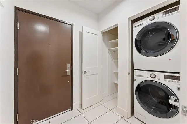 a view of a hallway with washer and dryer