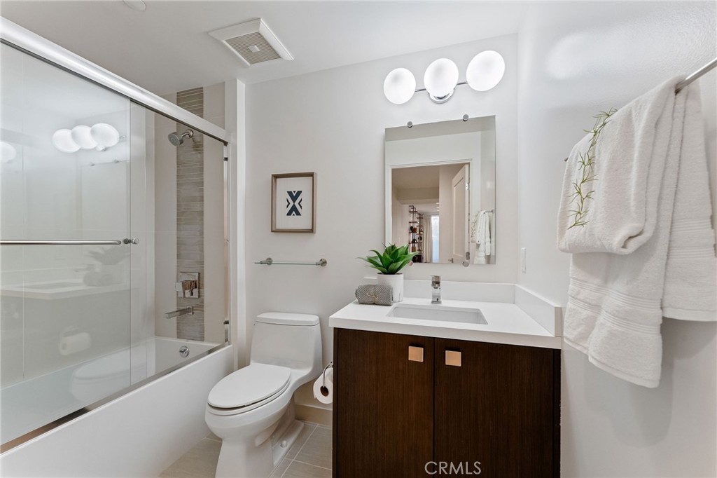 118 North Kings Road, Unit 201 Los Angeles, CA 90048 - Photo 7 of 38 a bathroom with a sink a toilet and shower