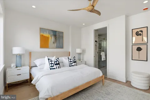 a bedroom with a bed and a lamp