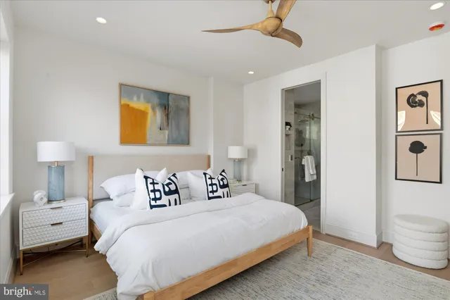 a bedroom with a bed and a lamp