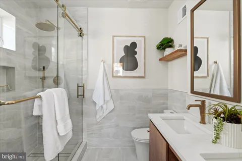 a bathroom with a sink and mirror