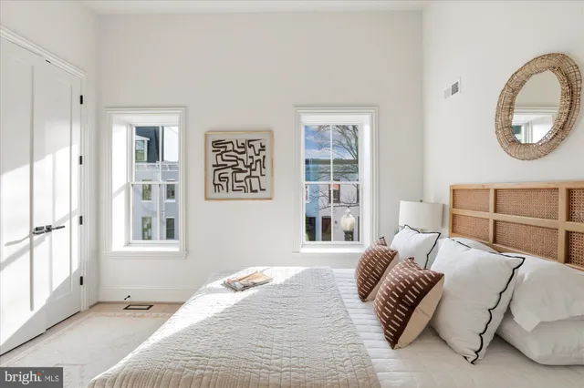 a bedroom with a large bed and a window