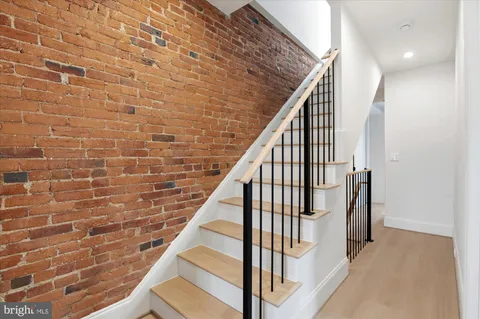 a view of entryway with wooden floor