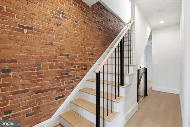 a view of entryway with wooden floor