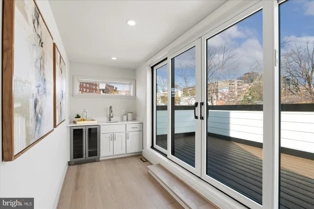 a kitchen with stainless steel appliances granite countertop a refrigerator and a stove