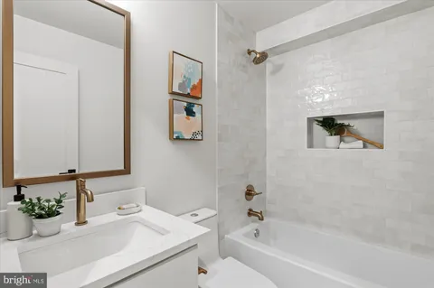 a bathroom with a bathtub and a sink