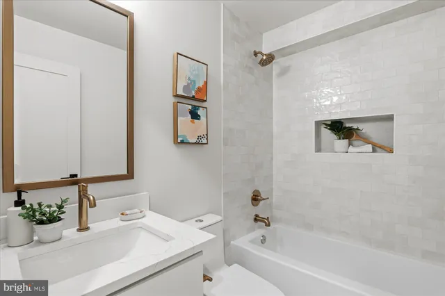 a bathroom with a bathtub and a sink