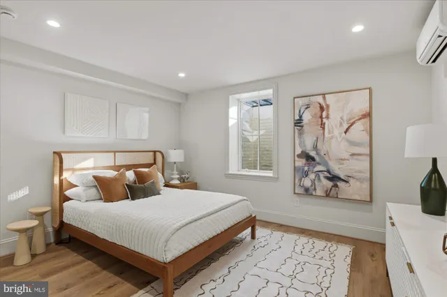 a bedroom with a large bed and a window