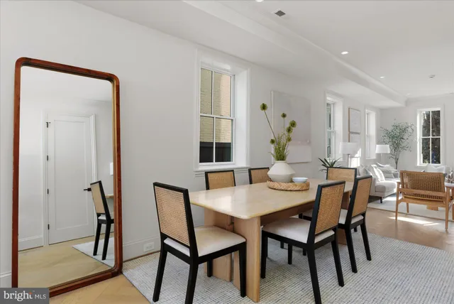 a dining room with furniture and window