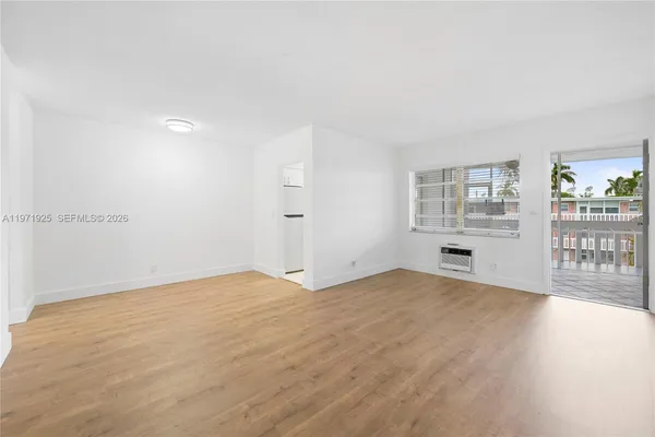 a view of an empty room with a window