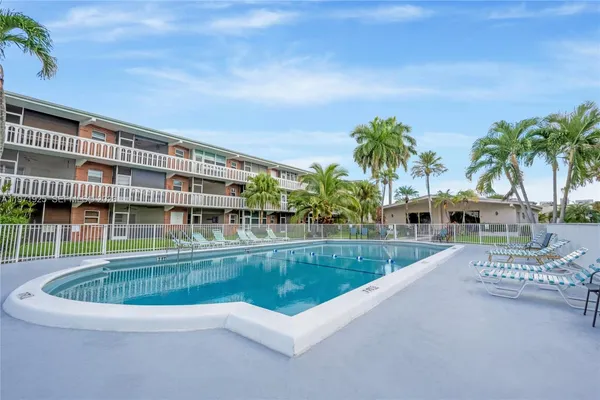 a view of swimming pool with a yard