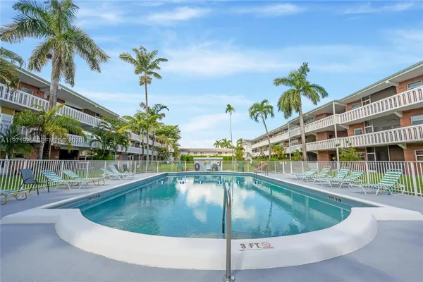 a view of a swimming pool with a patio